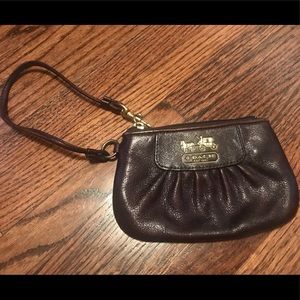 Brown leather coach wristlet